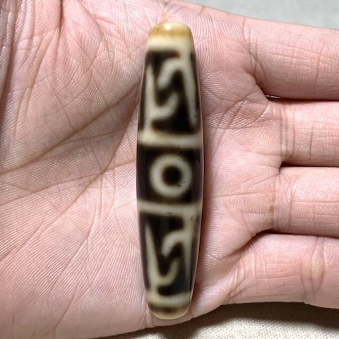 Ritual Object and Three Eyed Dzi Bead