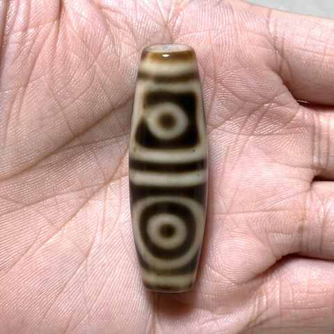 Sakor Namkor and Four Eyed Dzi Bead